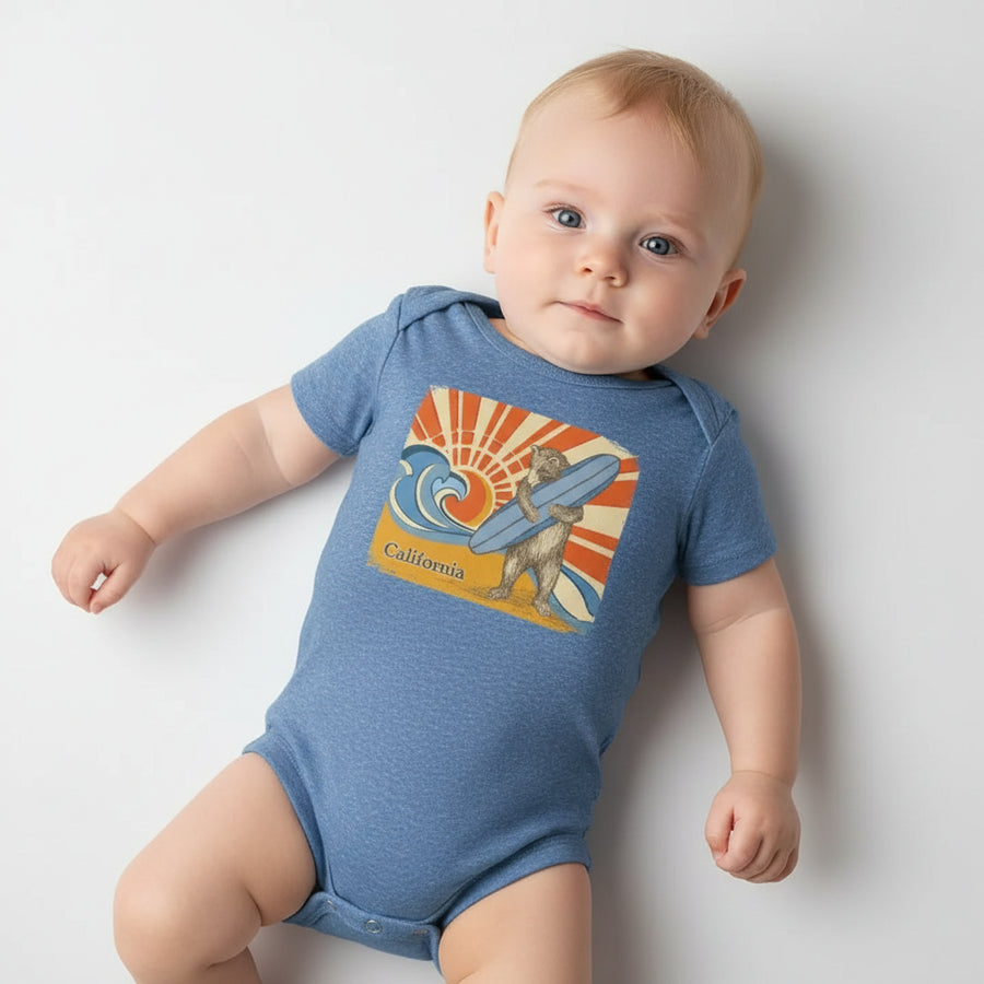 Blue baby onesie with a bear holding a surfboard and 'California' text on a white background, styled