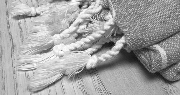 Turkish Towel Tassel Styles - Comparison of Twisted Knots, Single Knot Tassels, Fringe and Sewn Pom Poms - The Riviera Towel Company