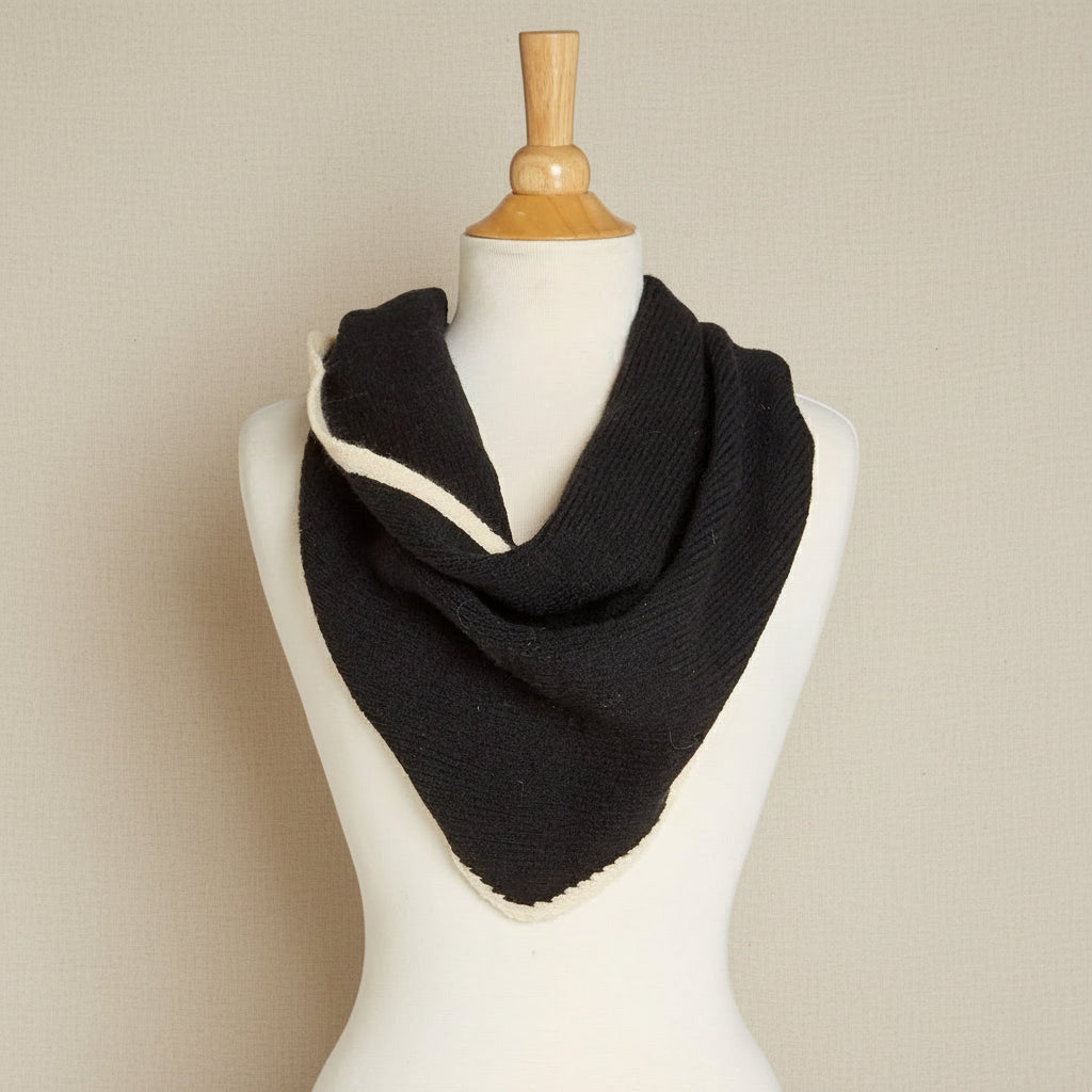 Black and white scarf on a mannequin with a white background
