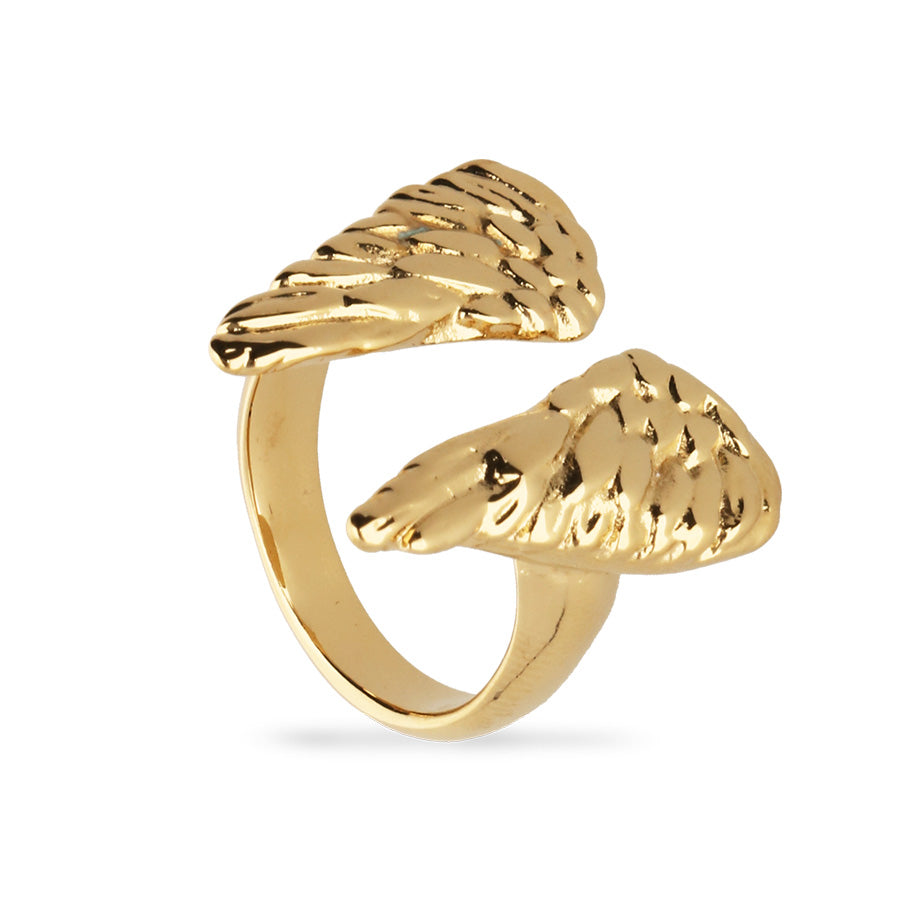 gold angel wing ring on white background