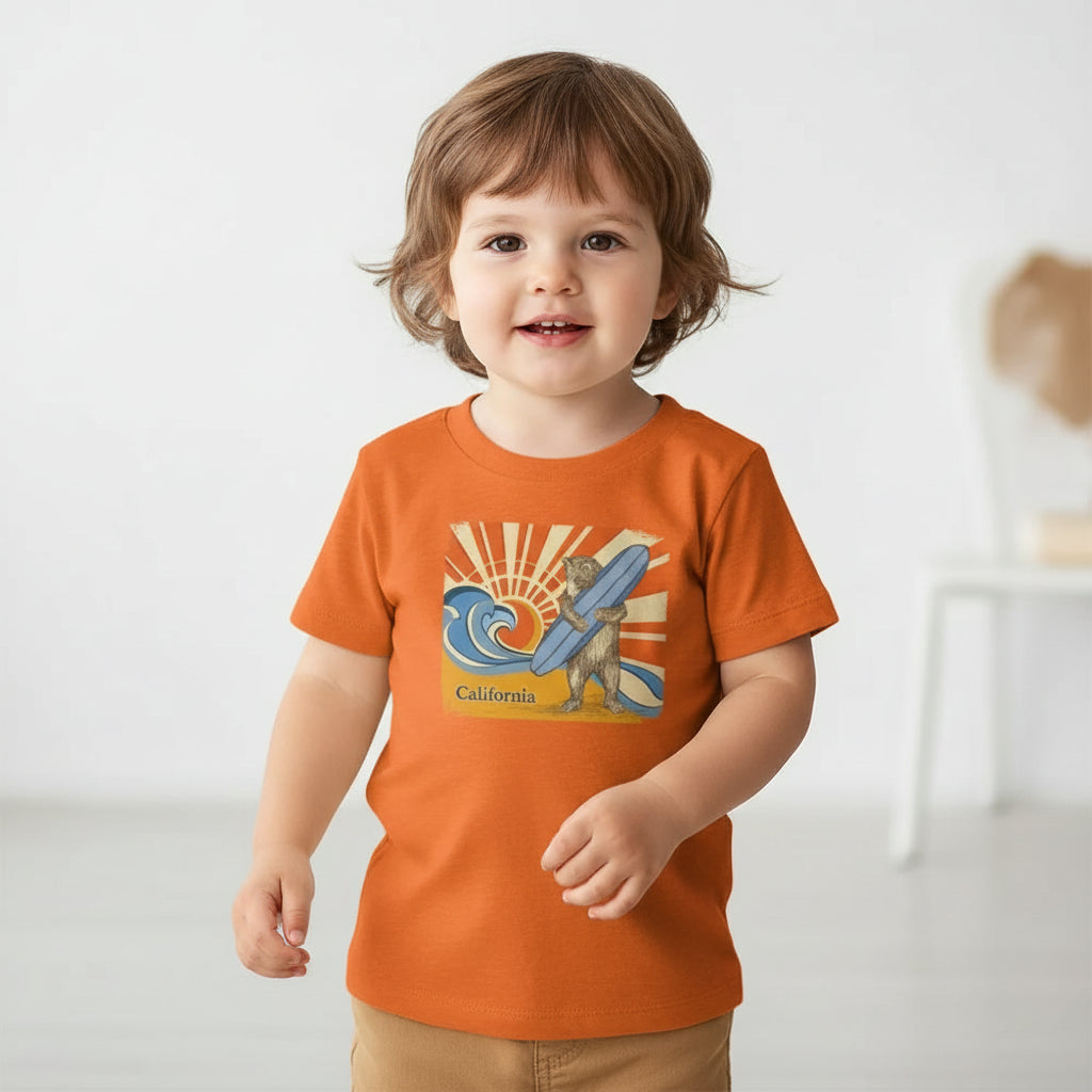 Orange t-shirt with a bear holding a surfboard and 'California' text on a white background