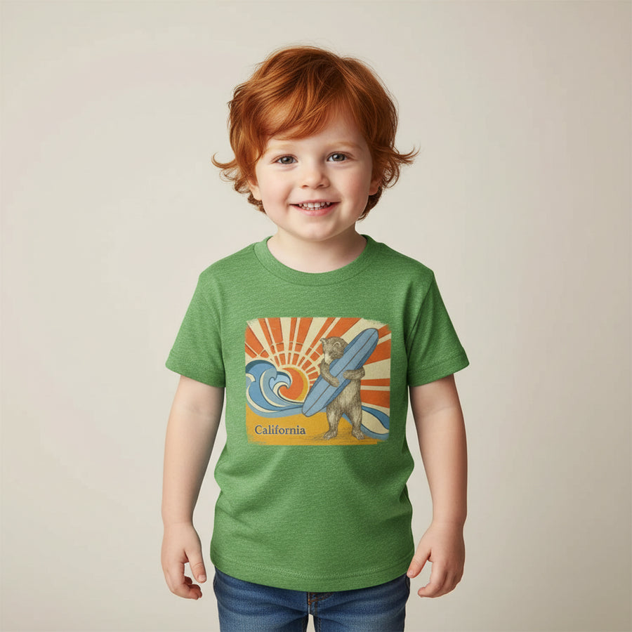 Green t-shirt with a bear holding a surfboard and 'California' text on a colorful background, styled