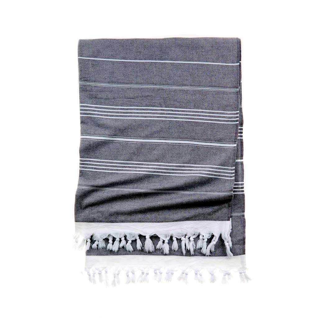 Luxury Turkish cotton beach towel folded on lounge chair