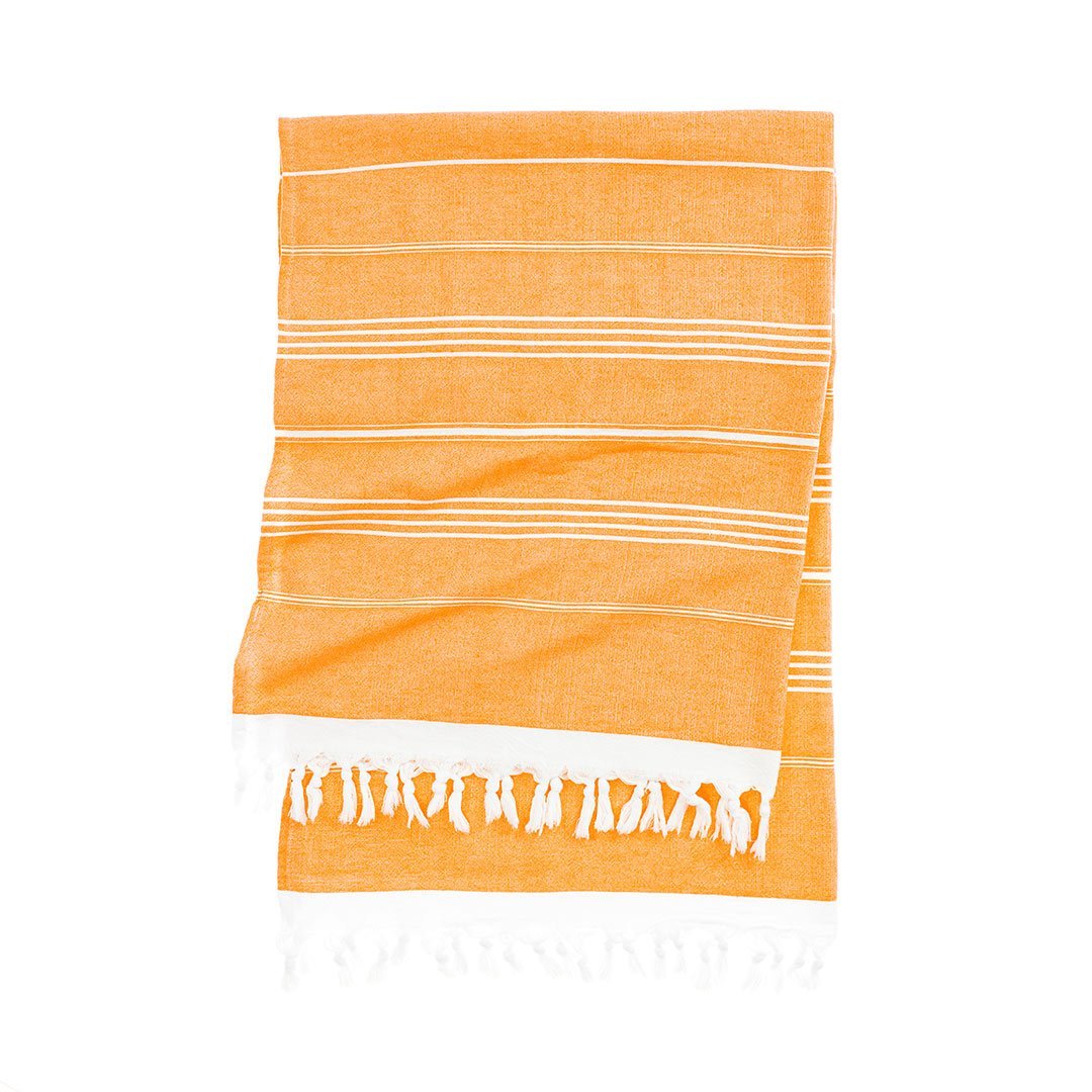 Soft textured terry cloth beach towel drying in the sun