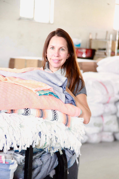 Holding freshly woven towels in the warehouse