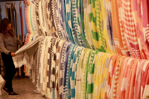 Walls of striped Turkish towels in the showroom