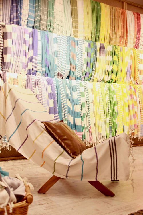 Colorful Turkish towels displayed in the showroom