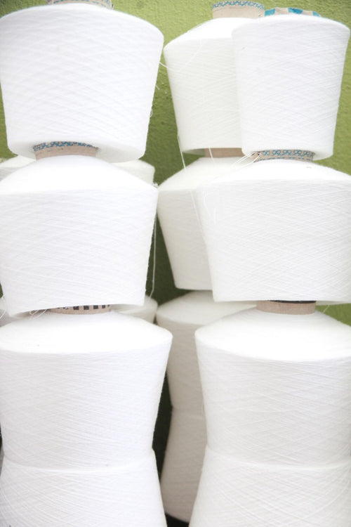 Cones of white Turkish cotton yarn