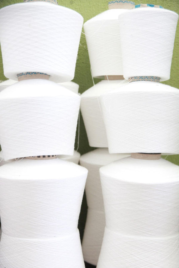 Cones of white Turkish cotton yarn
