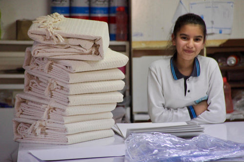 Folding finished towels at the workshop