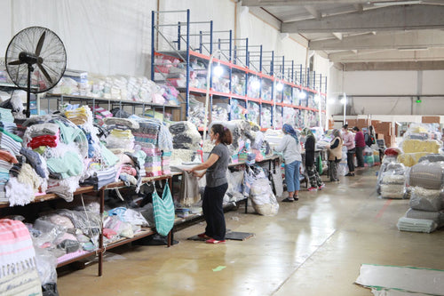Aisles of towels and blankets in the factory